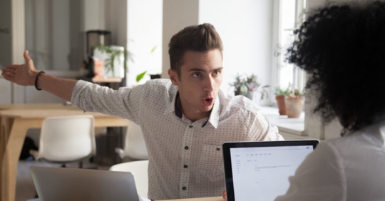 man yelling at woman in the workplace