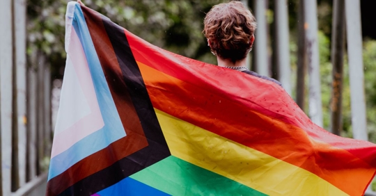 Person with LGBTQ+ Flag