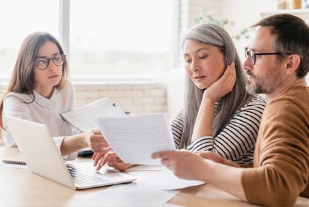 People looking over papers