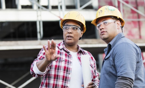 concerned conversation at a construction site