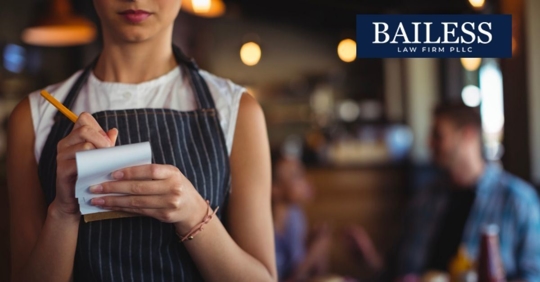 Waitress holding pen and pad