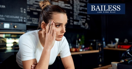 Woman in restaurant bar looking concerned